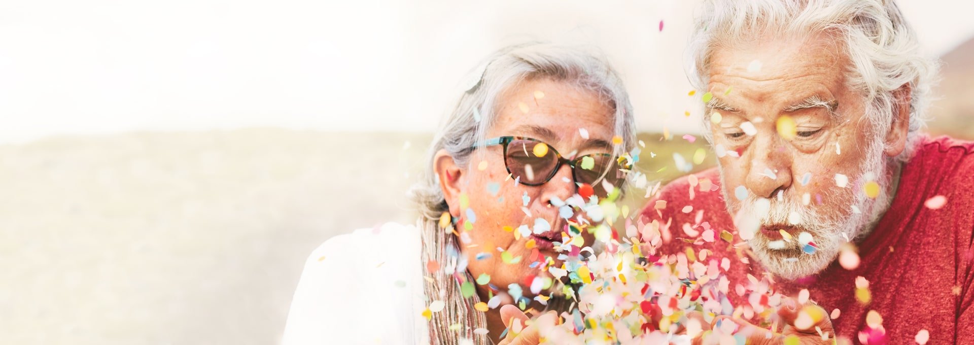 Older couple celebrating with confetti