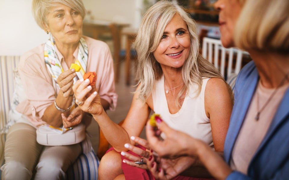Women chatting and eating macarons